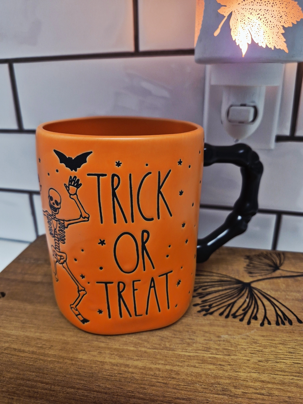 Rae Dunn Orange 'Trick or Treat' Mug with Black Skeleton Handle
